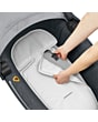 1510750110_2020_maxicosi_stroller_carrycot_jade_grey_essentialgraphite_harnessputaway_3qrt