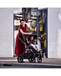 1978099110_F12_2026_maxicosi_stroller_oxfordplus_oaktruffle_oxford_lifestyle_mompushingstrollerthroughcity