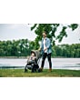 3333140541_2024_TinyLove_Activity_Arches_SunnyStroll_TinyRockers_dadandbabywalkingoutsidestroller
